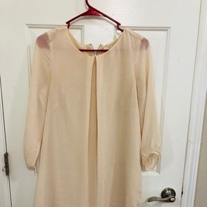 Like new Cream colour one piece knee length dress.